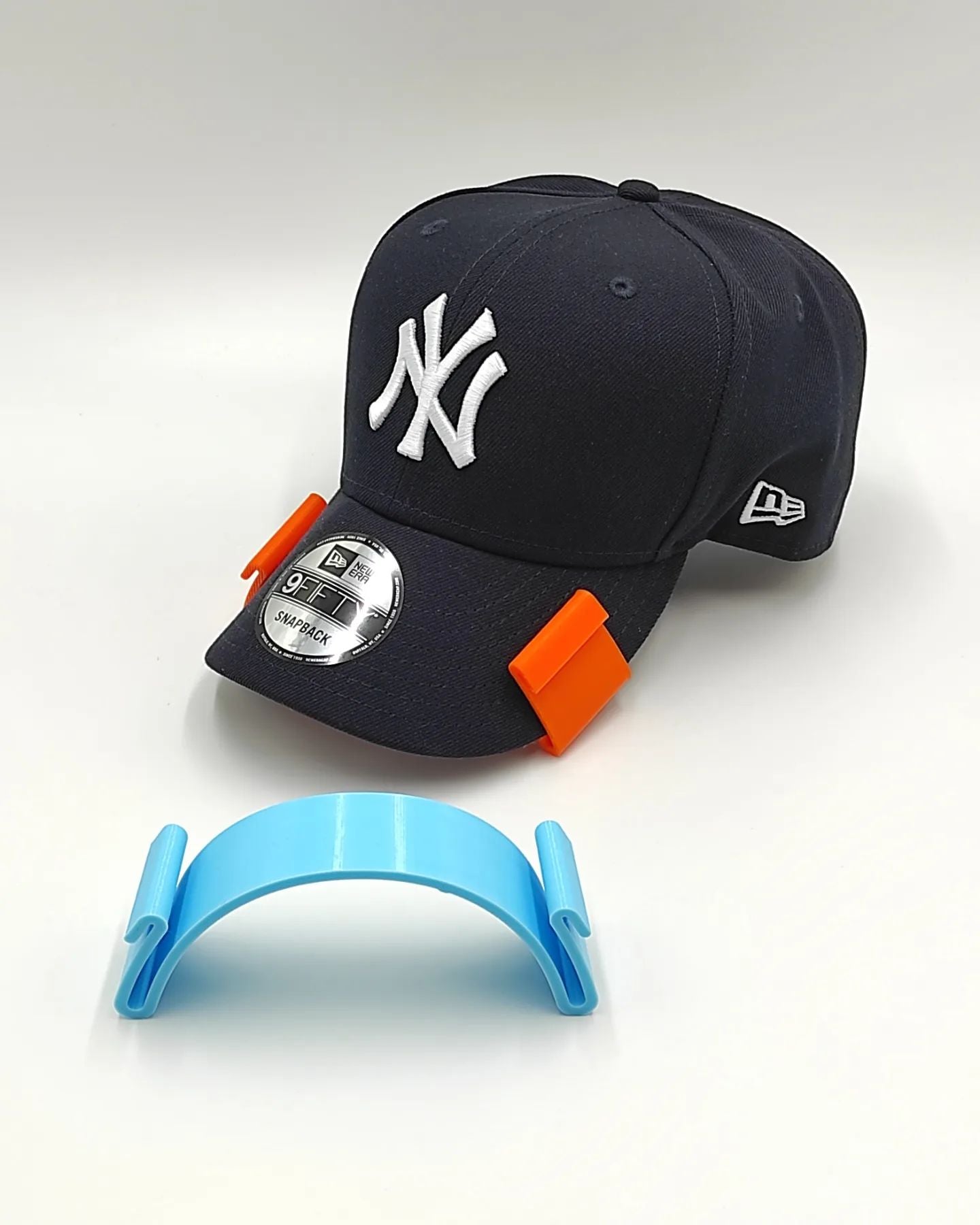 CURVADOR DE GORRAS
