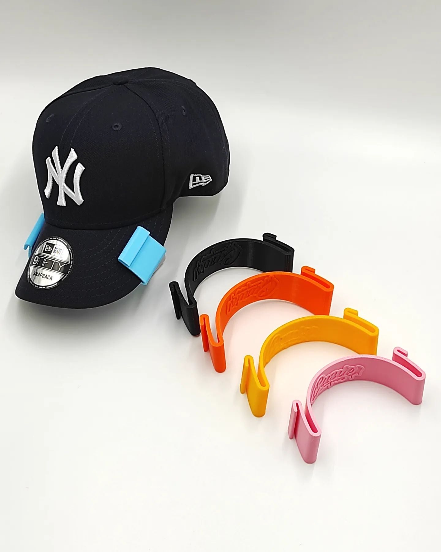 CURVADOR DE GORRAS