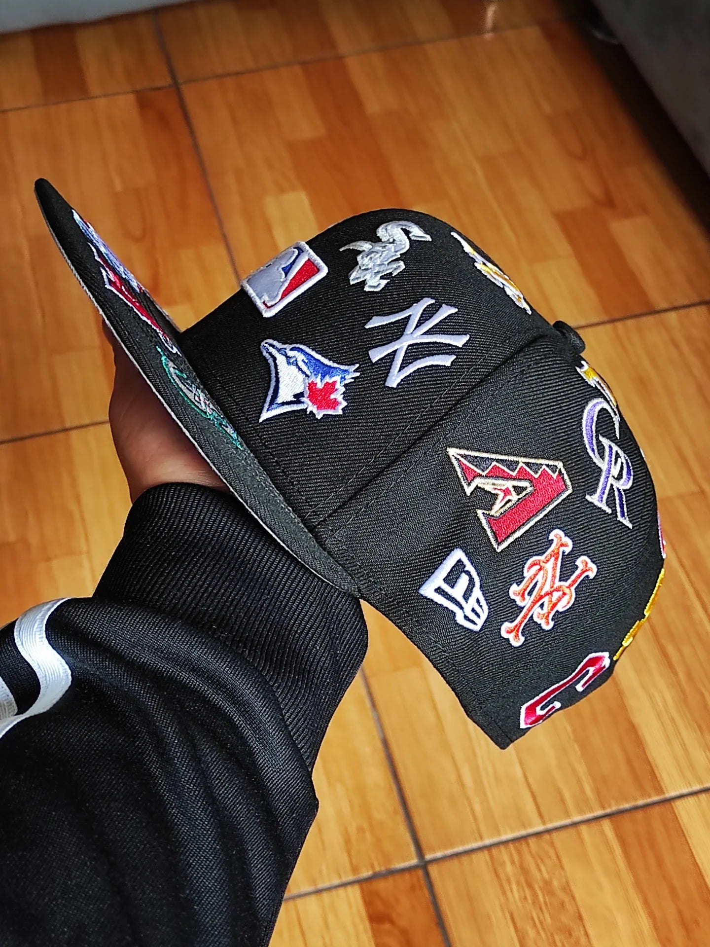 Gorra snapback New Era MLB negra 9Fifty, con logotipos de equipos de toda la liga