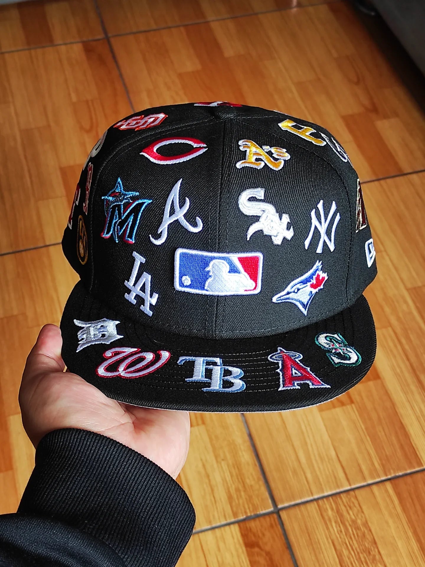 Gorra snapback New Era MLB negra 9Fifty, con logotipos de equipos de toda la liga
